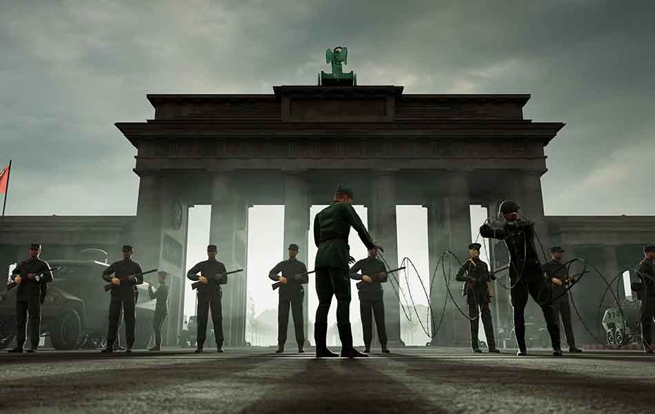 Soldaten der DDR spannen einen Stacheldraht vor dem Brandenburger Tor.